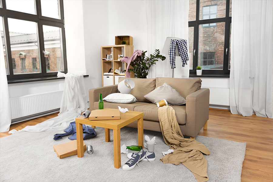 A semi-clean living room in St. Charles, MO with a small mess that needs to be cleaned by a professional maid cleaning service.