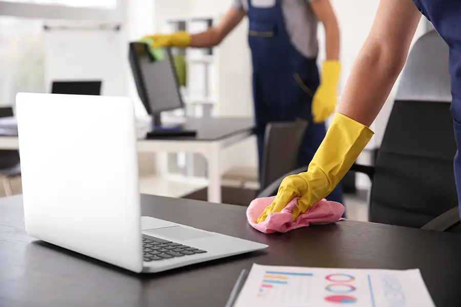 Cleaners in a commercial building in St. Louis, MO cleaning office space.